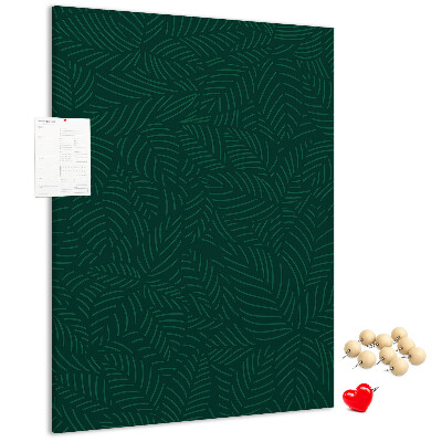 Pizarra de corcho decorativa con diseño de hojas sobre fondo verde oscuro