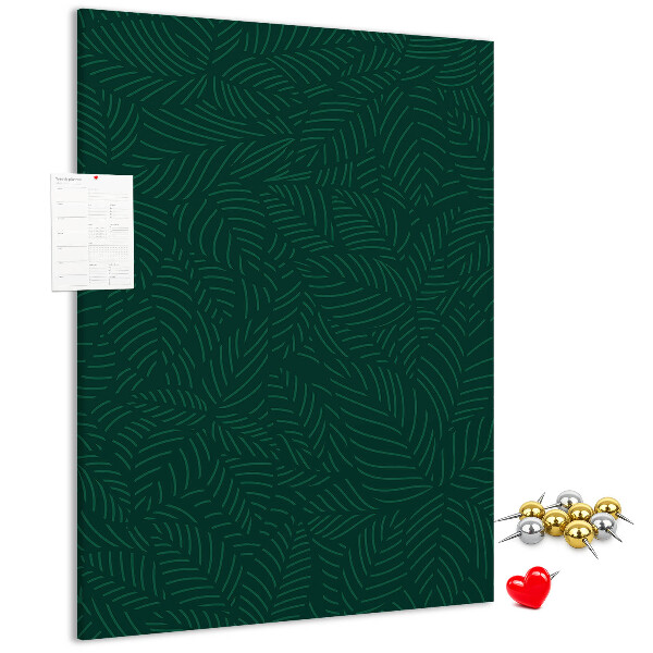 Pizarra de corcho decorativa con diseño de hojas sobre fondo verde oscuro