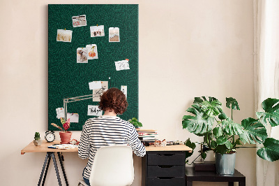 Pizarra de corcho decorativa con diseño de hojas sobre fondo verde oscuro