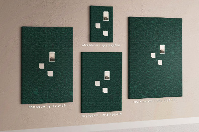 Pizarra de corcho decorativa con diseño de hojas sobre fondo verde oscuro