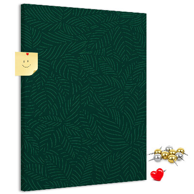 Pizarra de corcho decorativa con diseño de hojas sobre fondo verde oscuro
