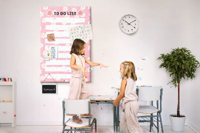 Pizarra de corcho decorativa con estampado floral sobre fondo rosa