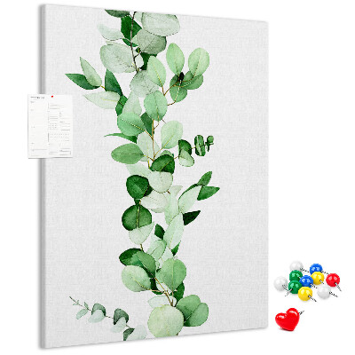 Pizarra de corcho decorativa hojas verdes sobre un fondo claro