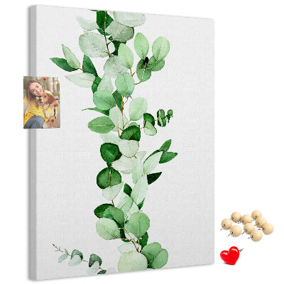 Pizarra de corcho decorativa hojas verdes sobre un fondo claro