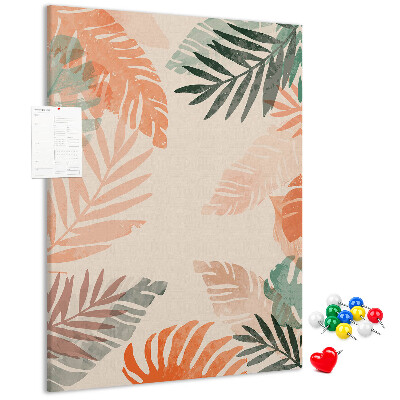 Pizarra de corcho decorativa con diseño de hojas tropicales en tonos suaves
