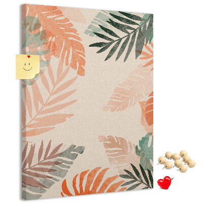 Pizarra de corcho decorativa con diseño de hojas tropicales en tonos suaves