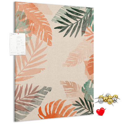 Pizarra de corcho decorativa con diseño de hojas tropicales en tonos suaves