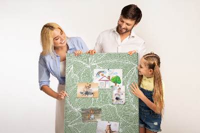Pizarra de corcho decorativa hojas delicadas sobre fondo verde