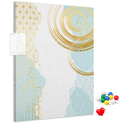 Tablero de corcho para pared con diseño de círculos dorados sobre un fondo delicado