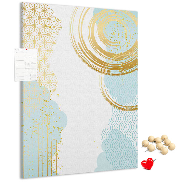 Tablero de corcho para pared con diseño de círculos dorados sobre un fondo delicado