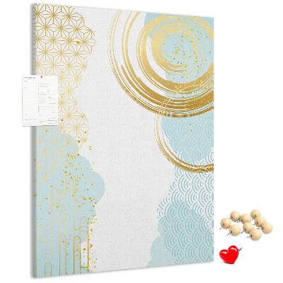 Tablero de corcho para pared con diseño de círculos dorados sobre un fondo delicado