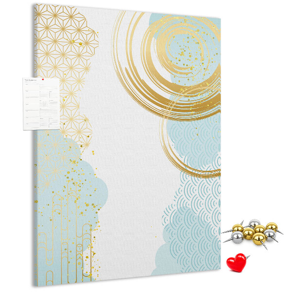 Tablero de corcho para pared con diseño de círculos dorados sobre un fondo delicado