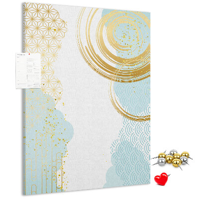 Tablero de corcho para pared con diseño de círculos dorados sobre un fondo delicado