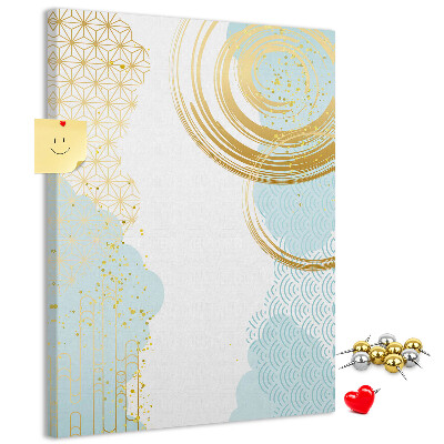 Tablero de corcho para pared con diseño de círculos dorados sobre un fondo delicado