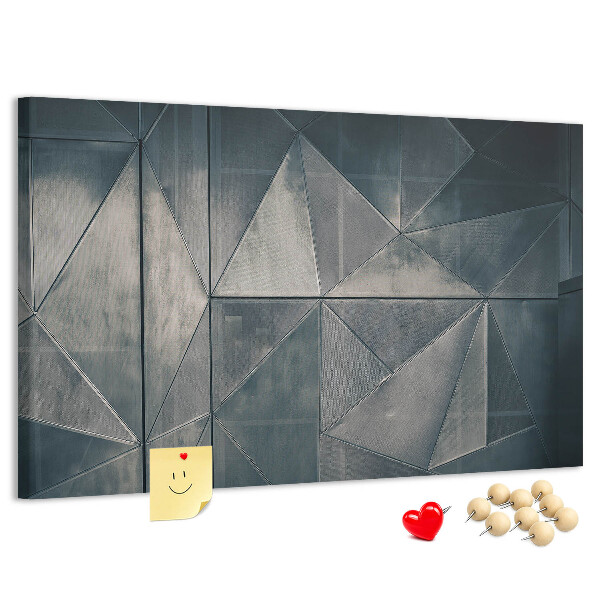 Tablero de anuncios con diseño de formas geométricas en tonos grises