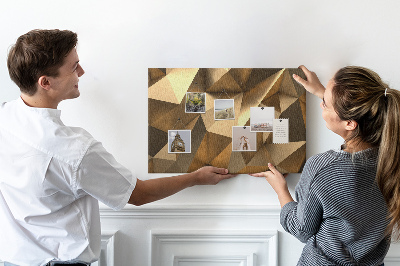 Pizarra de corcho con diseño de formas geométricas en tonos marrones