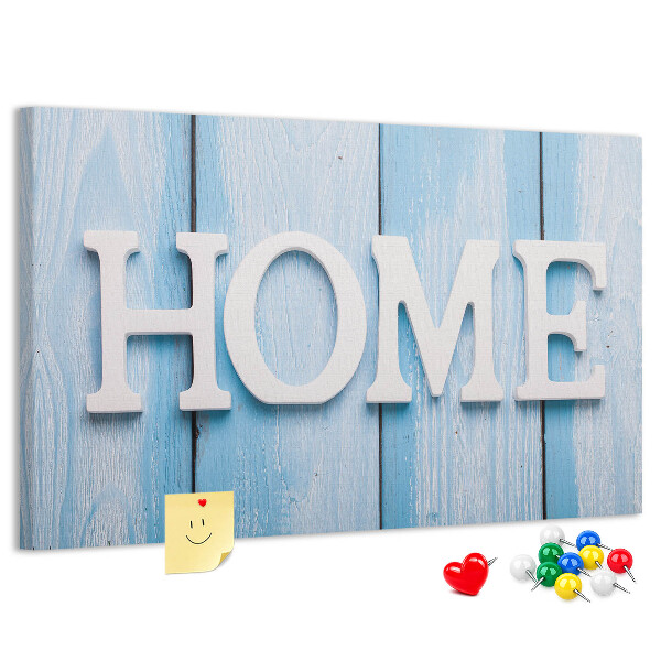 Pizarra de corcho con elegante inscripción HOME sobre fondo azul