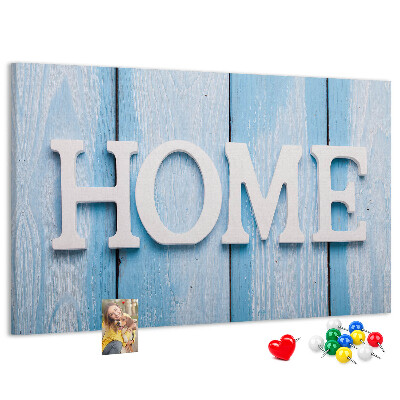 Pizarra de corcho con elegante inscripción HOME sobre fondo azul