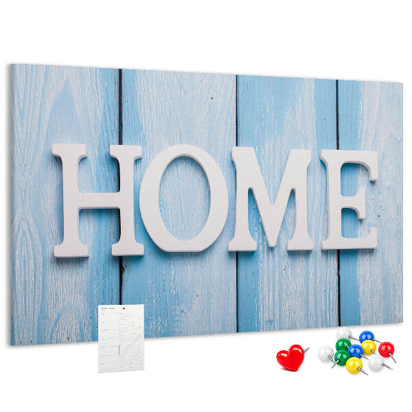 Pizarra de corcho con elegante inscripción HOME sobre fondo azul