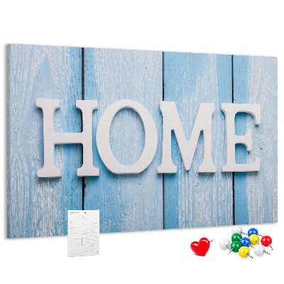 Pizarra de corcho con elegante inscripción HOME sobre fondo azul