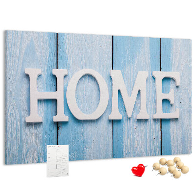 Pizarra de corcho con elegante inscripción HOME sobre fondo azul