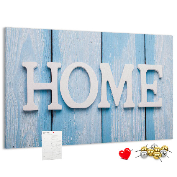 Pizarra de corcho con elegante inscripción HOME sobre fondo azul