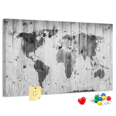 Tablero de anuncios Un mapamundi sobre un fondo de tablas de madera.