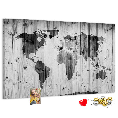 Tablero de anuncios Un mapamundi sobre un fondo de tablas de madera.