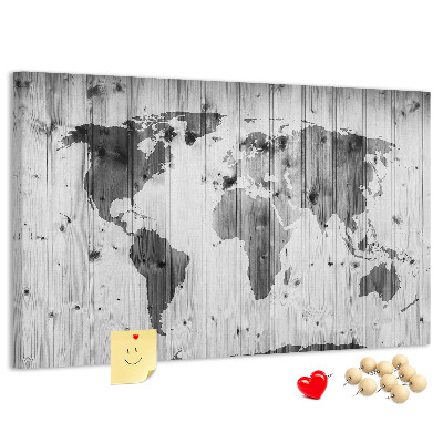 Tablero de anuncios Un mapamundi sobre un fondo de tablas de madera.