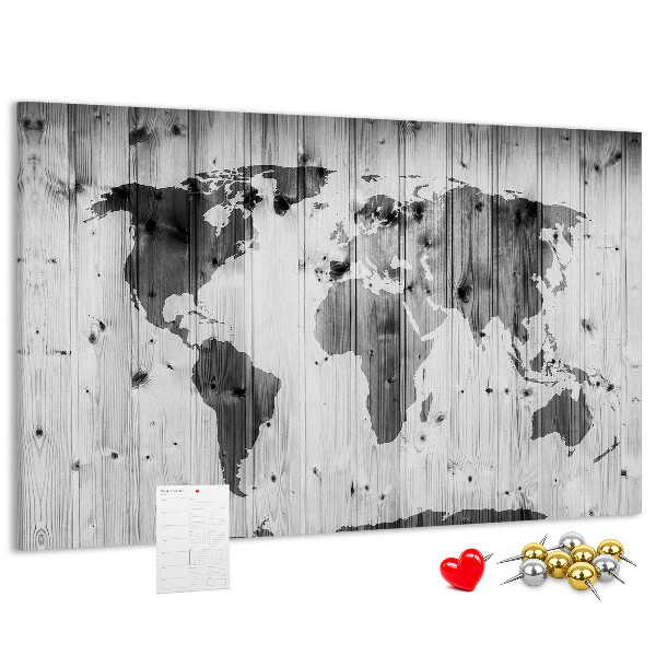 Tablero de anuncios Un mapamundi sobre un fondo de tablas de madera.
