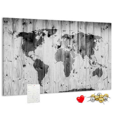 Tablero de anuncios Un mapamundi sobre un fondo de tablas de madera.