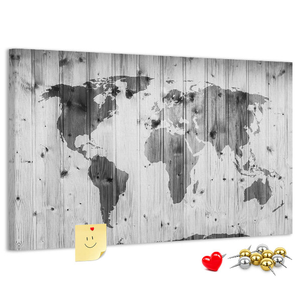 Tablero de anuncios Un mapamundi sobre un fondo de tablas de madera.