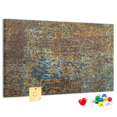 Pizarra de corcho Superficie oxidada con detalles azules.