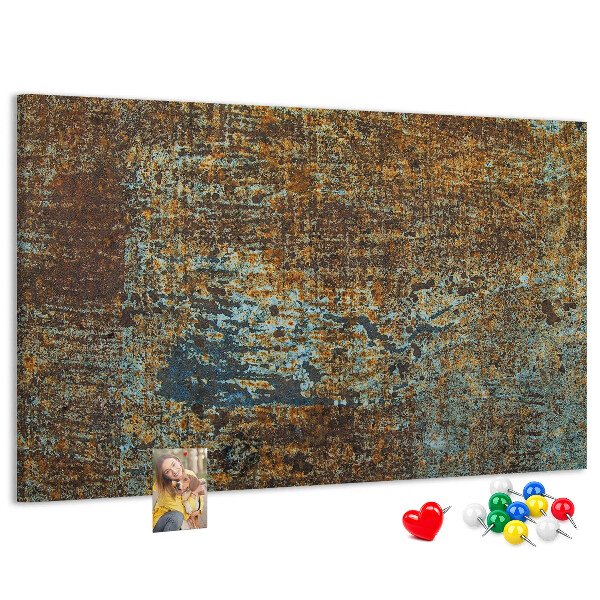 Pizarra de corcho Superficie oxidada con detalles azules.