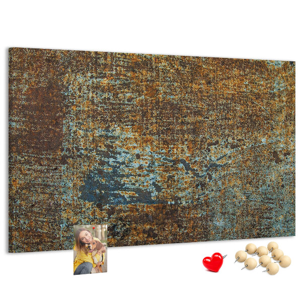 Pizarra de corcho Superficie oxidada con detalles azules.