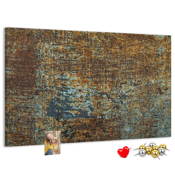 Pizarra de corcho Superficie oxidada con detalles azules.