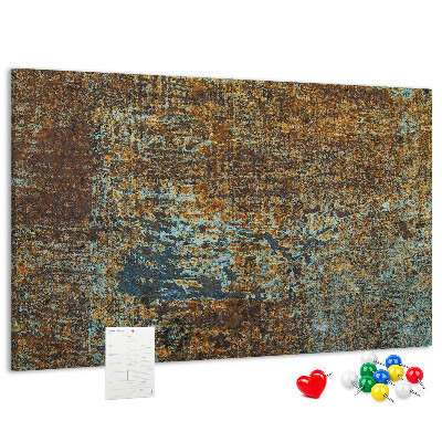 Pizarra de corcho Superficie oxidada con detalles azules.
