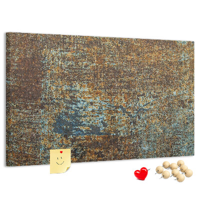 Pizarra de corcho Superficie oxidada con detalles azules.