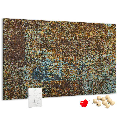 Pizarra de corcho Superficie oxidada con detalles azules.