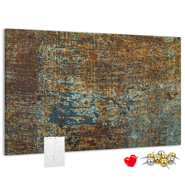 Pizarra de corcho Superficie oxidada con detalles azules.