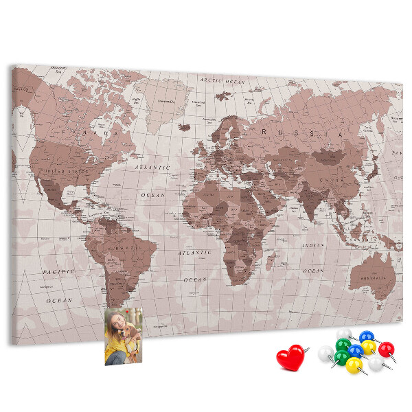 Tablero de corcho decorado Un mapamundi en tonos rosas.