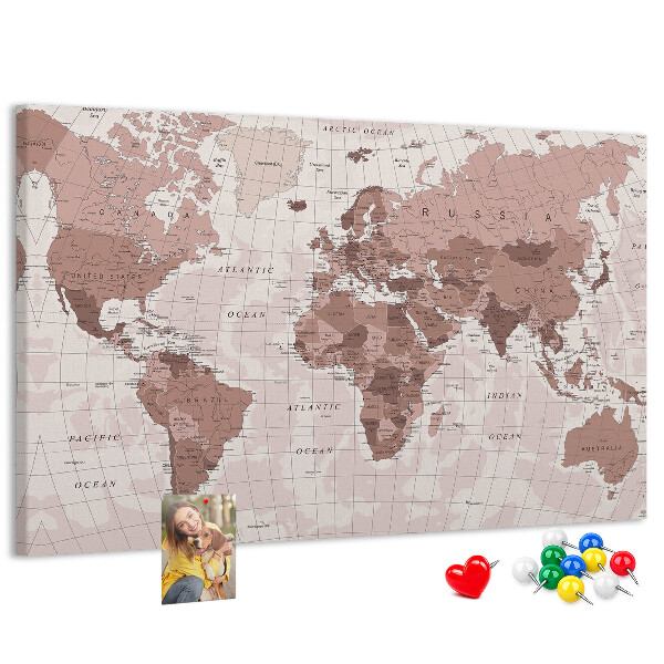 Tablero de corcho decorado Un mapamundi en tonos rosas.