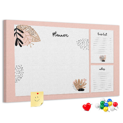 Tablero de corcho decorado Una elegante agenda con detalles florales.