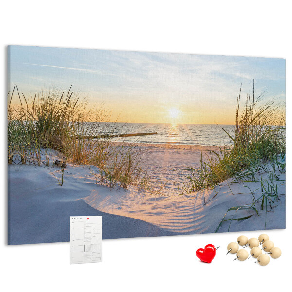 Tablero de anuncios Puesta de sol sobre la playa y las dunas.