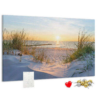 Tablero de anuncios Puesta de sol sobre la playa y las dunas.