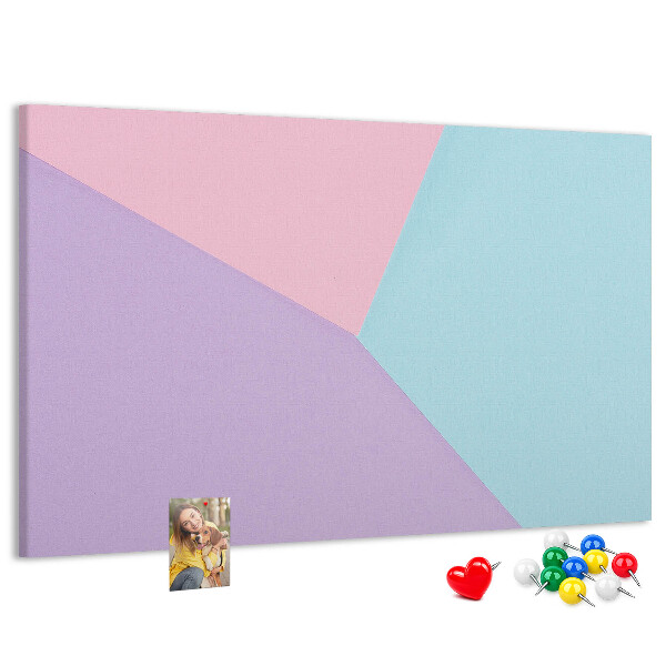 Pizarra de corcho con diseño de formas geométricas en colores pastel