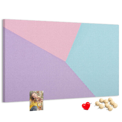 Pizarra de corcho con diseño de formas geométricas en colores pastel