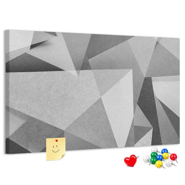 Pizarra de corcho con diseño de formas geométricas abstractas grises y negras