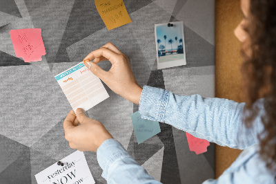 Pizarra de corcho con diseño de formas geométricas abstractas grises y negras