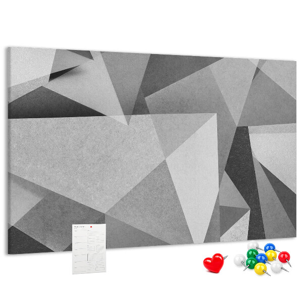 Pizarra de corcho con diseño de formas geométricas abstractas grises y negras